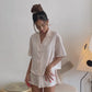 Video of the Julia Silk Pyjama Set in Blush. Front and back detailing polkadot pyjamas. Made from 100% soft and smooth viscose. Shop yours now at White Trousseau Singapore. 