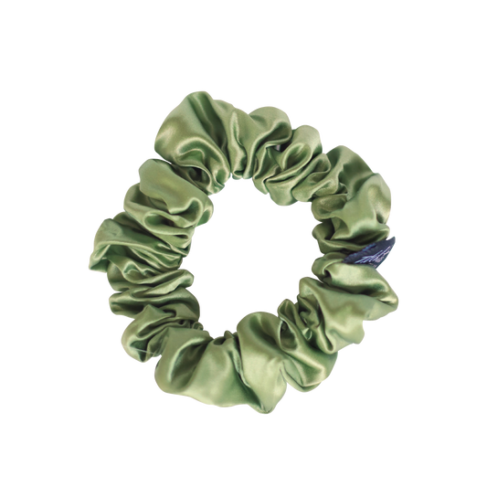 Sage Green mulberry silk srunchie. Mulberry silk is 100 percent natural. Our beautiful mulberry silk scrunchies glide over hair in a loving embrace that eliminates frizz, wrinkles, and knots while reducing hair damage. Say goodbye to breakage and welcome to healthy hair when worn on a daily basis.