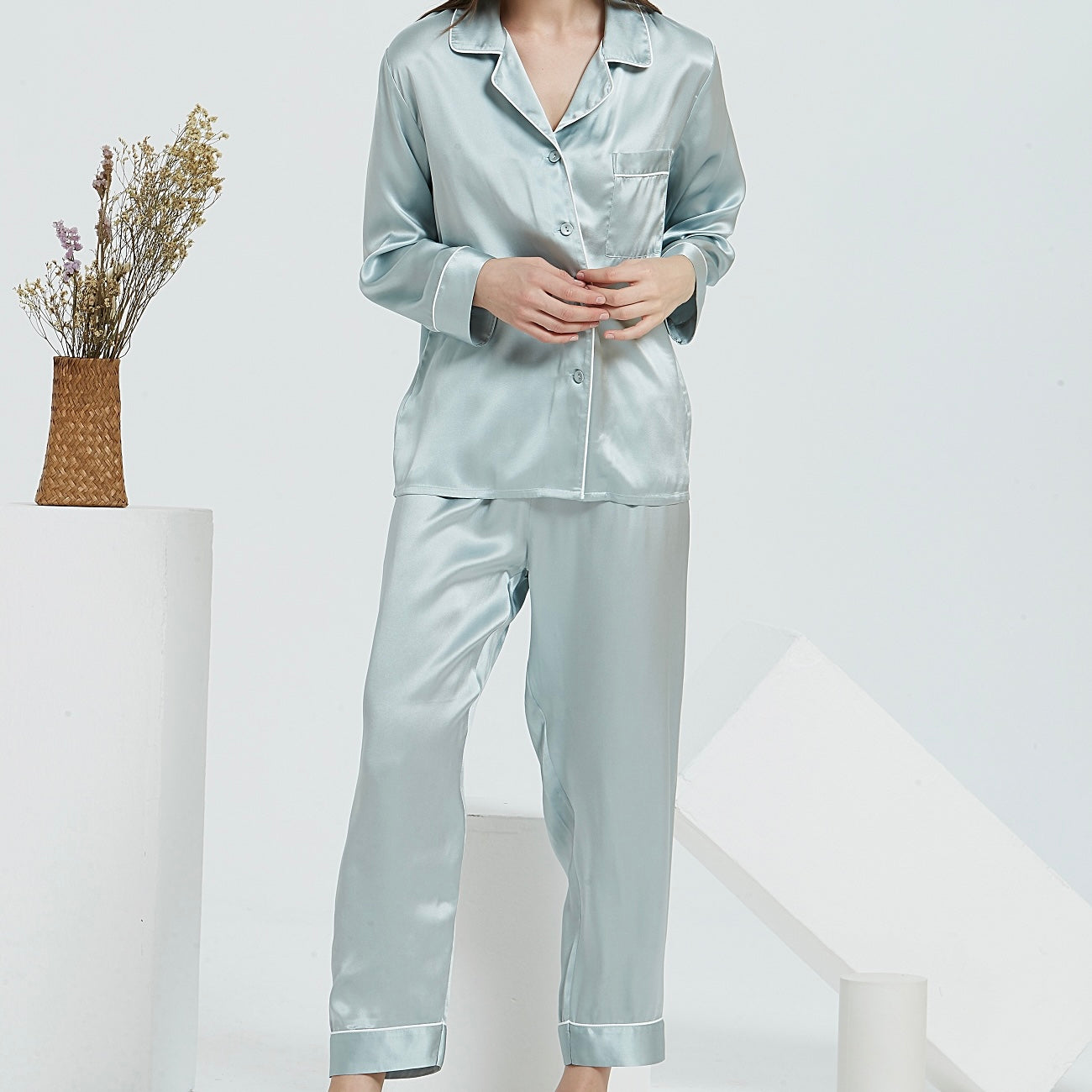 Pure Silk Long Pyjamas Set in Silver with White PipingWhite Trousseau’s Pure Mulberry Silk Long Pyjamas Set in Mint. High quality and breathable, our silk pyjamas set will make you feel stylish while lounging at home. It is the best sleepwear for Singapore weather!