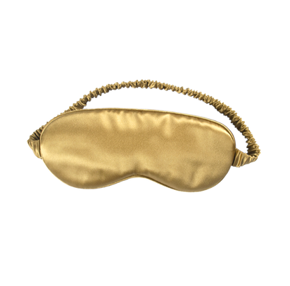 White Trousseau's 100% Mulberry Silk Eye Mask in Gold. Made of OEKO-TEX® certified, 22 momme organic silk, our sleep eye mask is specially made to cure dark eye circles, as well as puffy and swollen eyes. Wake up with brighter, healthier and anti-aging skin simply by wearing this to sleep! 