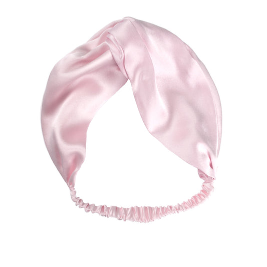 White Trousseau's 100% Mulberry Silk Headband in Pink. Add this to your daily routine for when you need to push up and hold your hair in place! Ultra-gentle and smooth on your hair, our silk headband prevents hair from creasing and kinking.