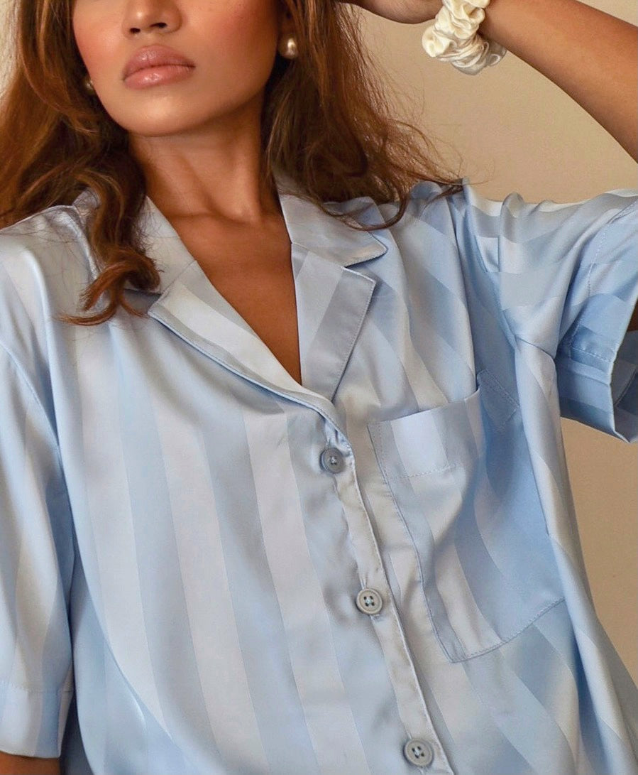 Sadie Pyjamas in Ocean with piping details and buttons. A comfortable sleepwear is our secret to beautiful sleep and at-home pampering. Made from 100% soft and smooth viscose silk. Shop yours now only at White Trousseau Singapore.