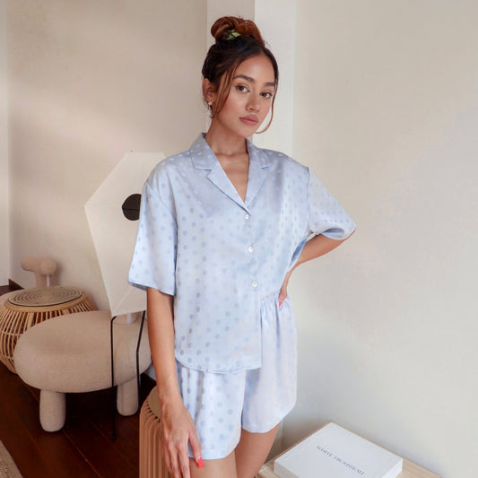  Julia Silk Pyjama Set in Ocean with Polkadot details. Crafted with 100% soft and smooth viscose. Shop now a pair of this pyjama set while looking cute and stylish on a casual day. An essential sleepwear for everyday comfort in your own home.
