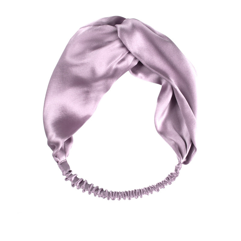 White Trousseau's 100% Mulberry Silk Headband in Lilac. Made of OEKO-TEX® certified, organic mulberry silk, our silk headbands prevent hair from creasing and kinking, resulting in sleek and smooth strands.