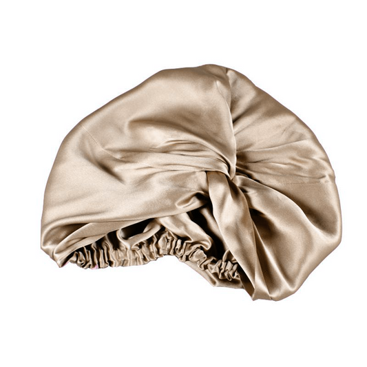 White Trousseau 100% Pure Mulberry Silk hair Turban in Champagne. Mulberry silk is less absorbent than any other fabric, leaving hair more hydrated, glowing, and healthier 