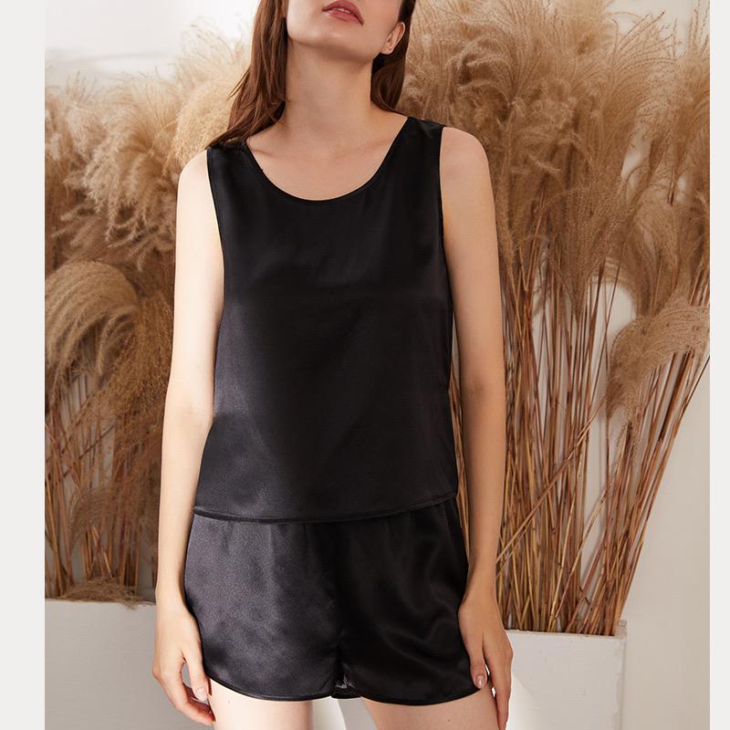 White Trousseau’s Pure Mulberry Silk Sleeveless Pyjamas Set in Black. Our silk sleepwear sets are specially made for Singapore weather - cooling and breathable to wear!